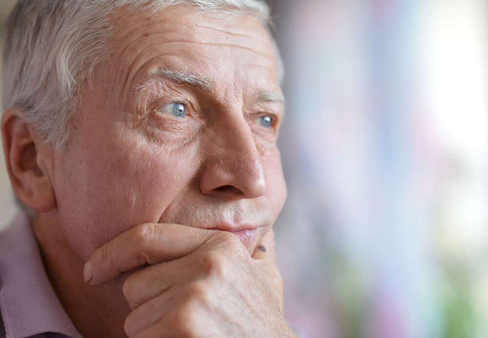 An old man looking off camera