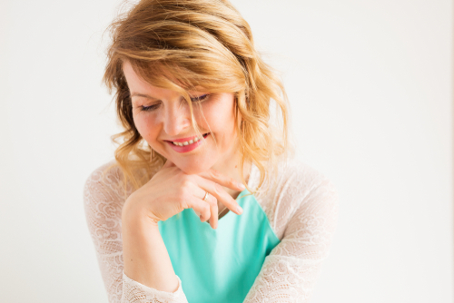 Young woman smiling after visiting an Ophthalmologist